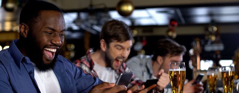 men playing gambling in a cafe